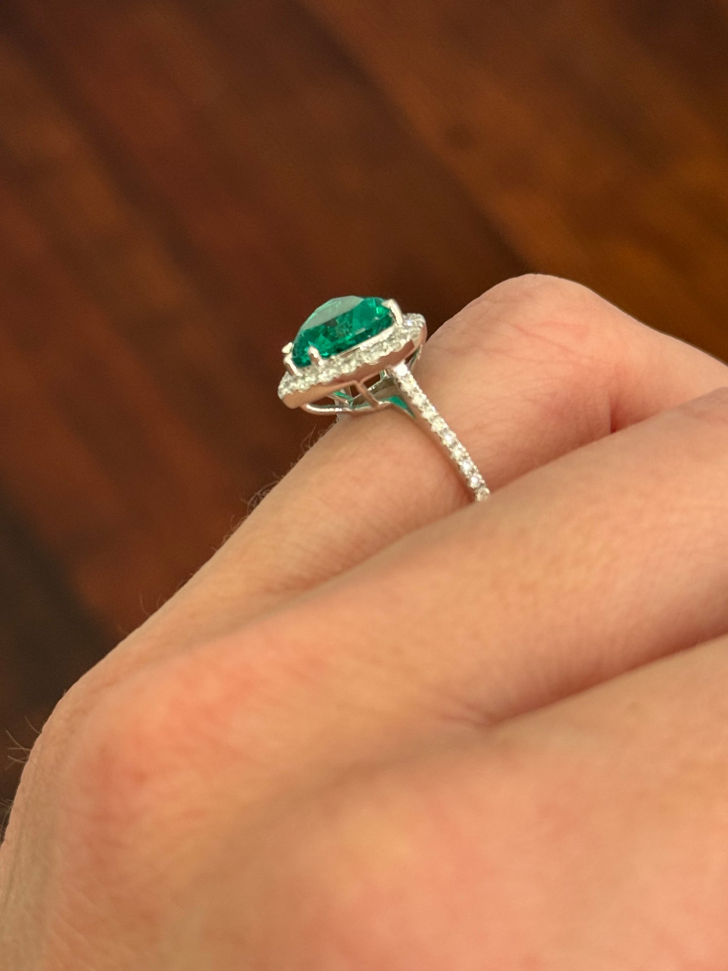 White gold heart shape lab emerald and round lab diamond ring