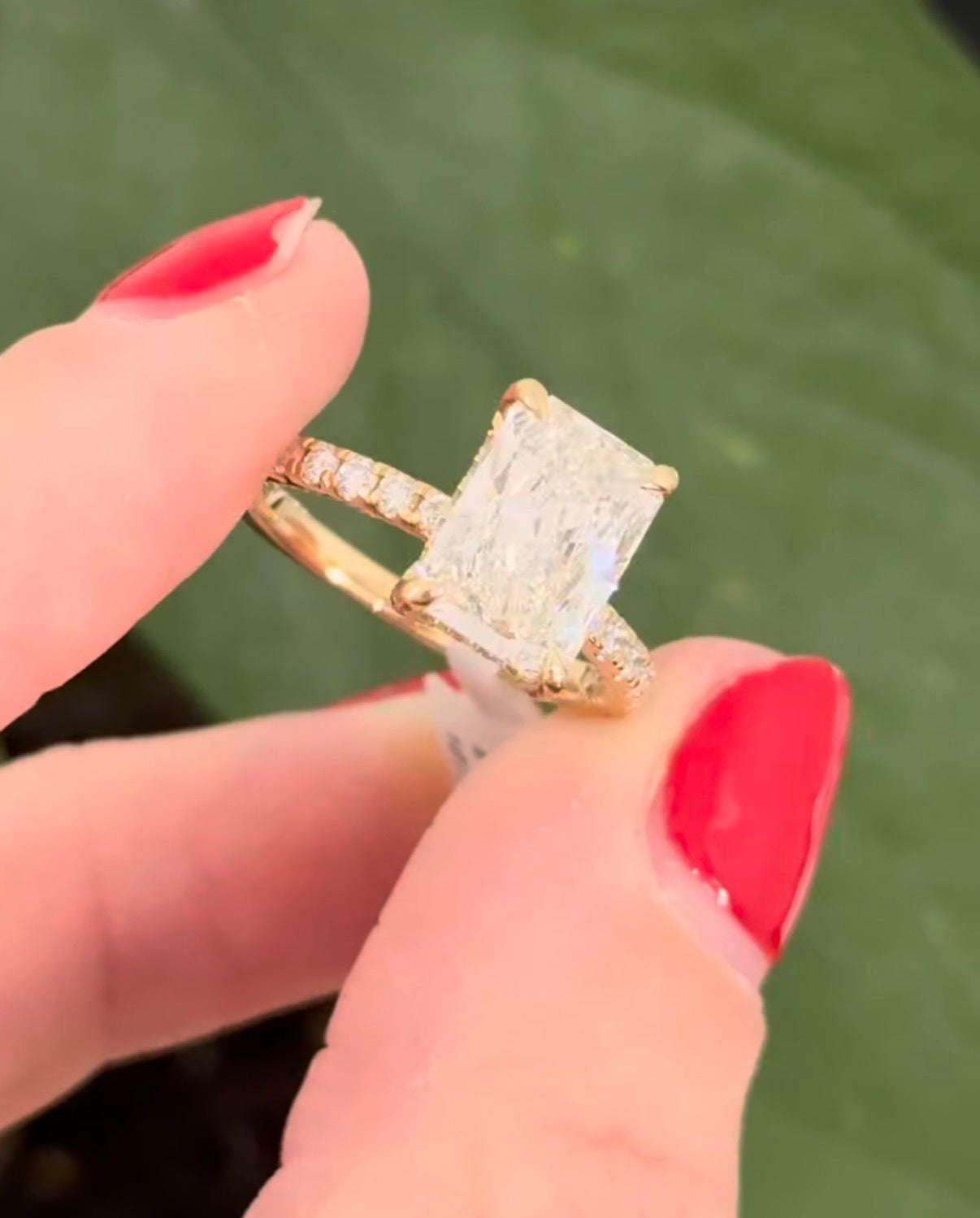 Yellow gold radiant lab diamond ring. Center stone is IGI certified and 3.0cts E VS1