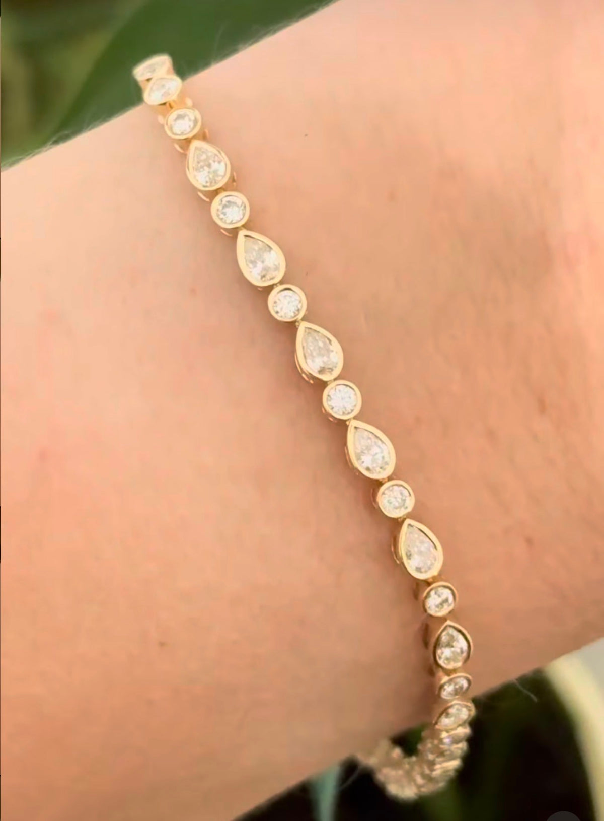 Yellow gold bezel set 3ct pear shape and round natural diamond bracelet