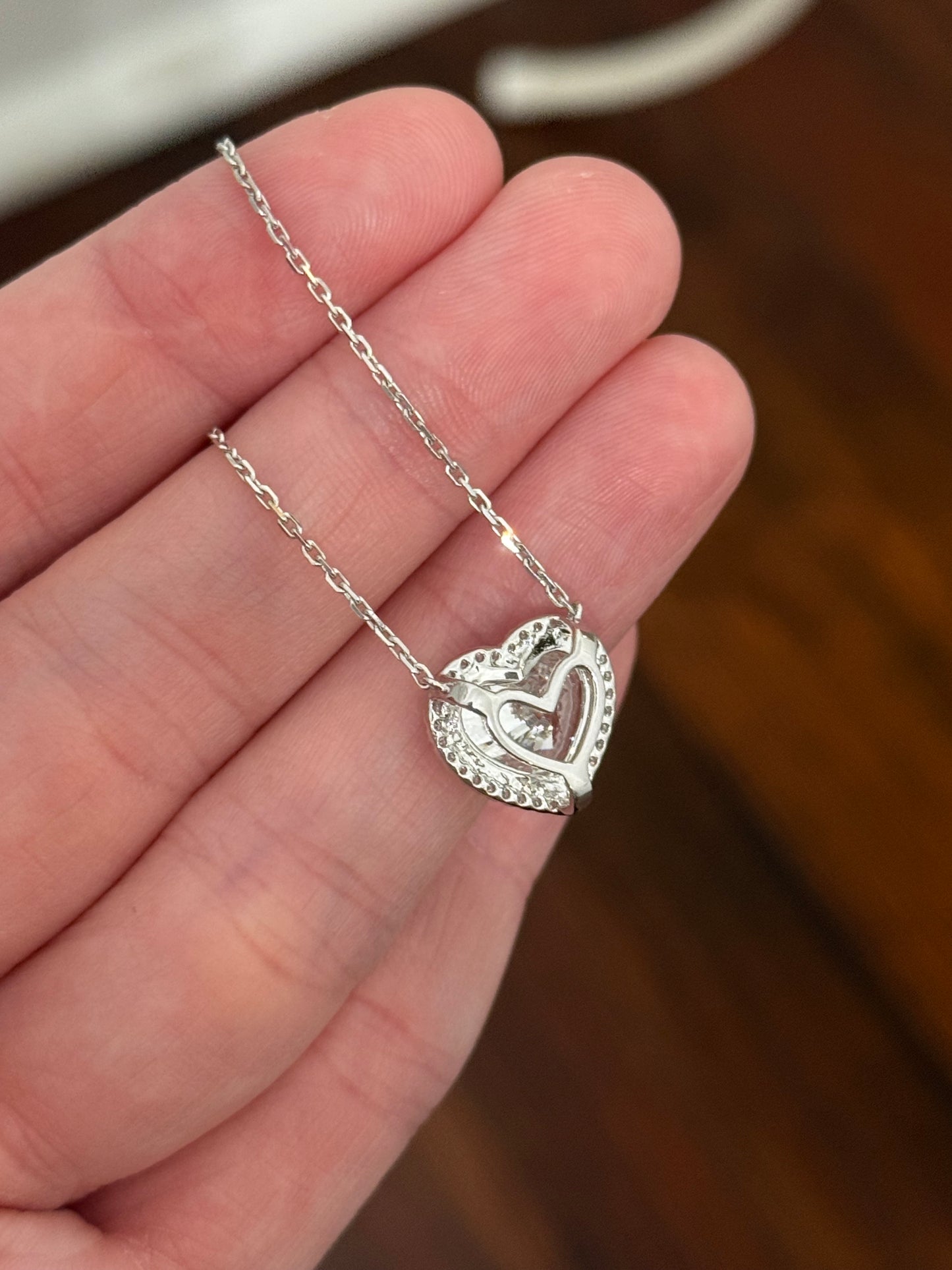 White gold heart shape lab diamond necklace. Center stone is 5.08cts and measures 10.x11.3mm. Chain is 16” with 4” of adjustment to make as long as 20”.