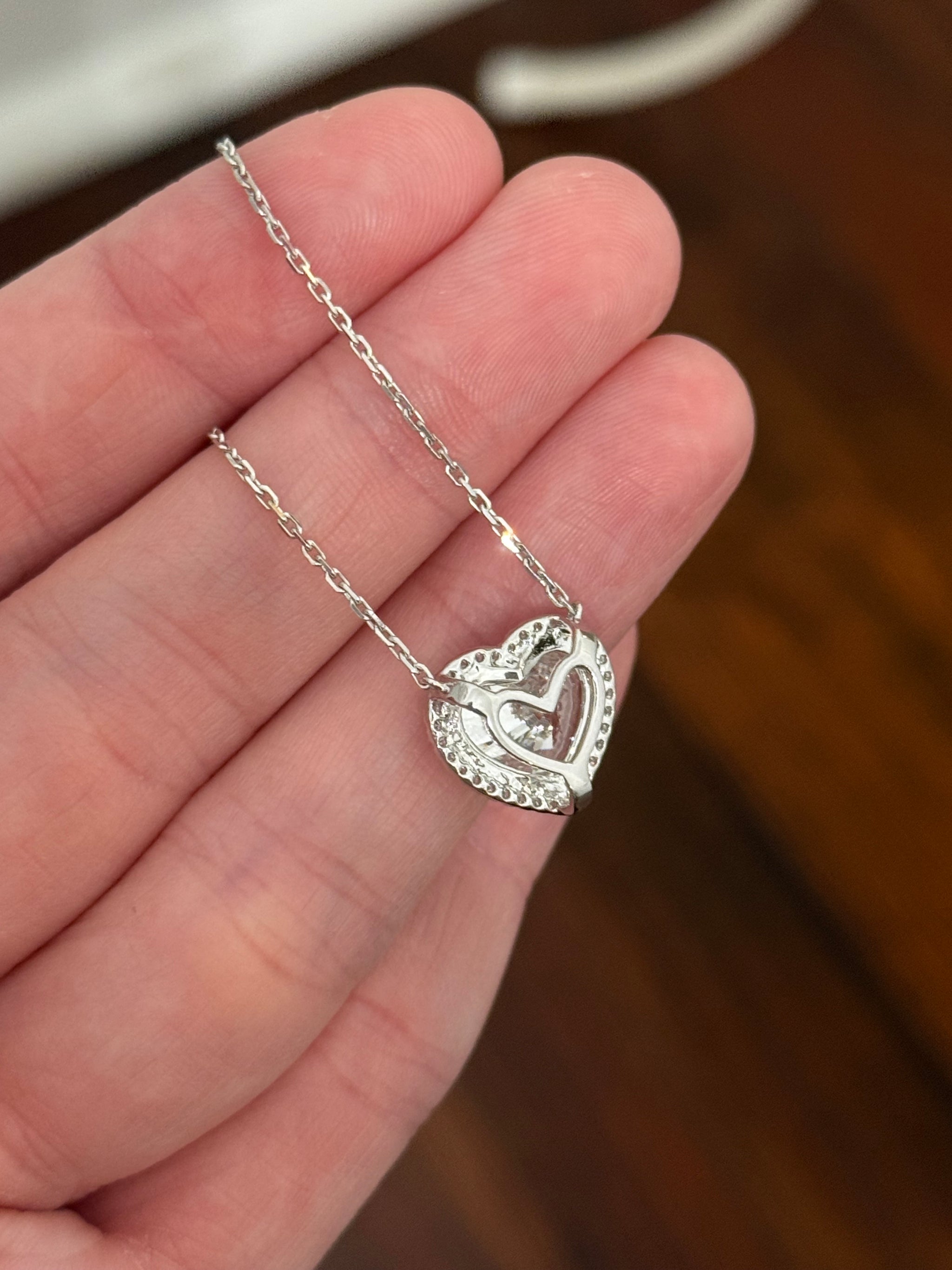 White gold heart shape lab diamond necklace. Center stone is 5.08cts and measures 10.x11.3mm. Chain is 16” with 4” of adjustment to make as long as 20”.
