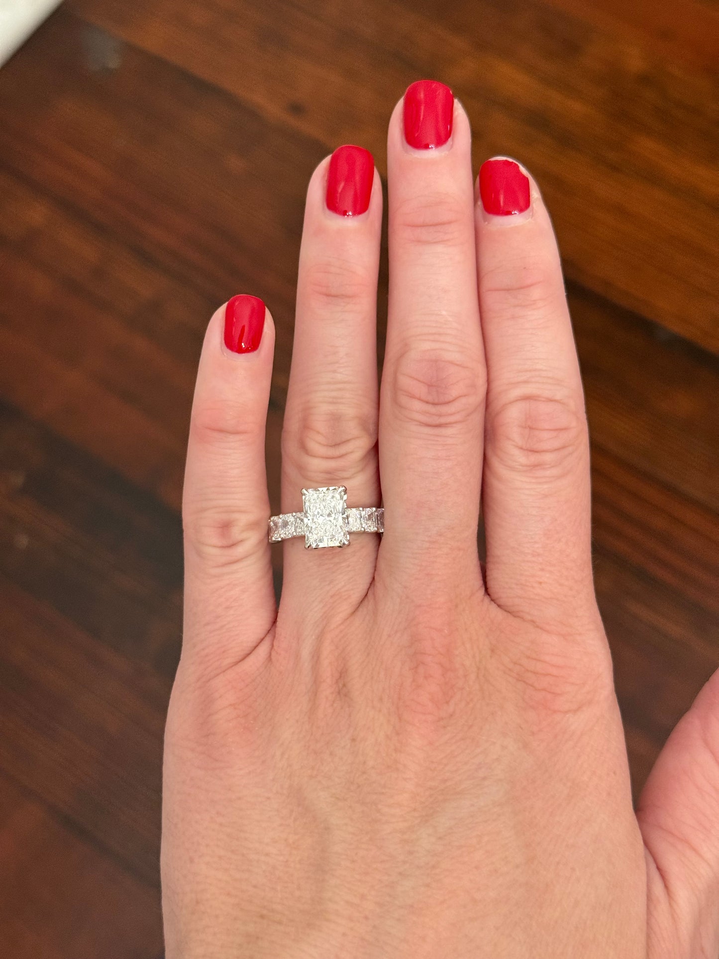 White gold radiant lab diamond ring. Center stone is IGI certified and 3.09cts E VVS2