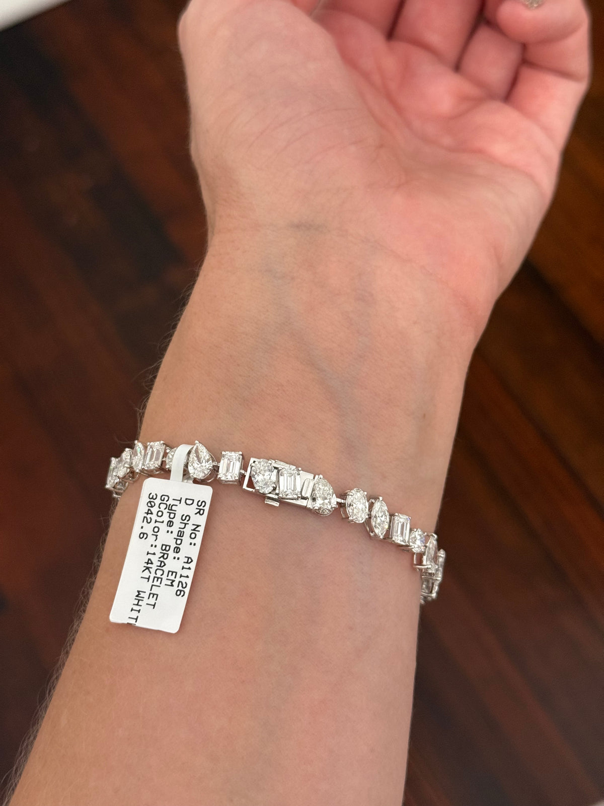 White gold mixed shape bracelet with 15.57cts of pear shape, oval, marquise, emerald cut and round lab diamonds