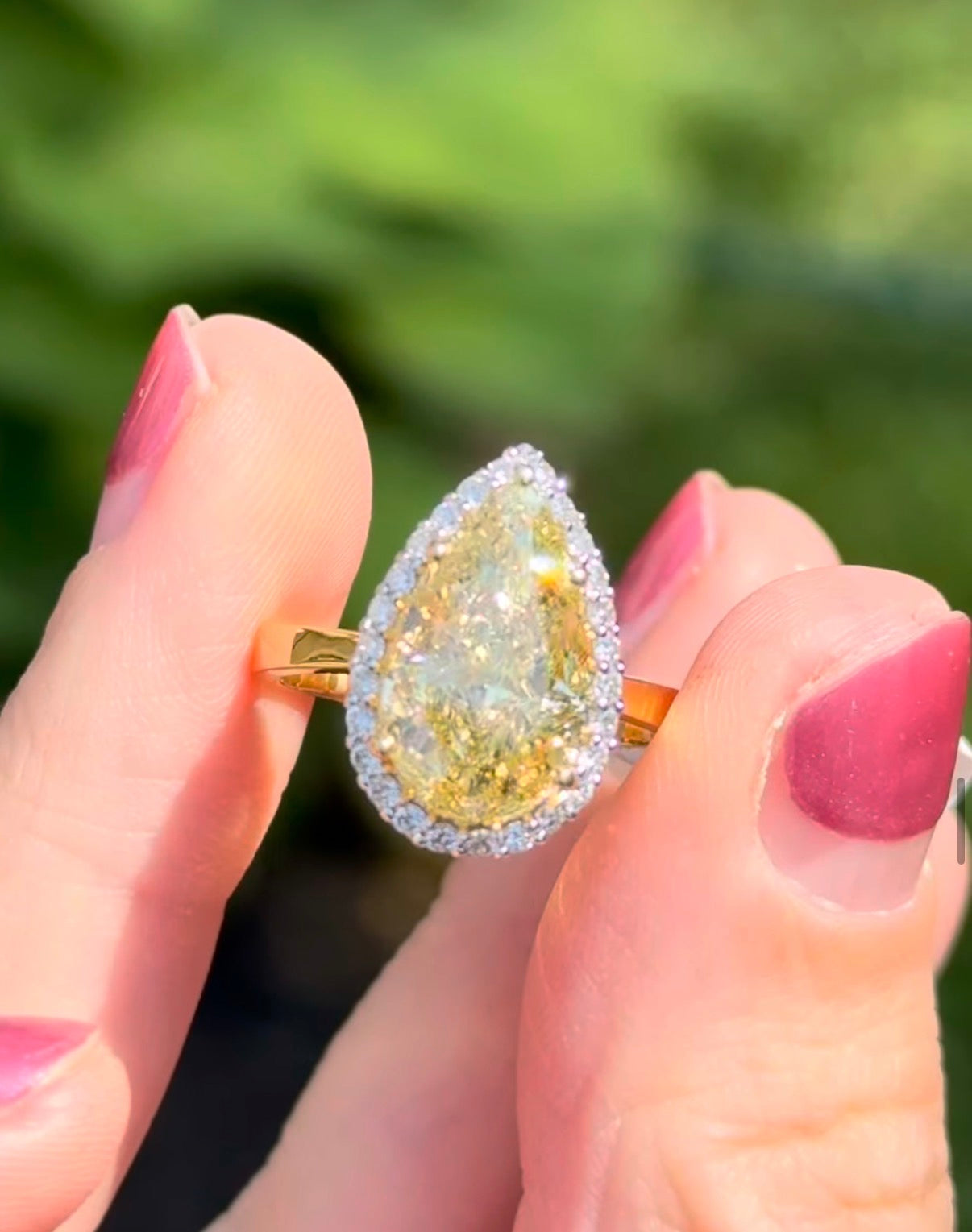 Yellow gold pear shape yellow lab diamond and white lab diamond ring