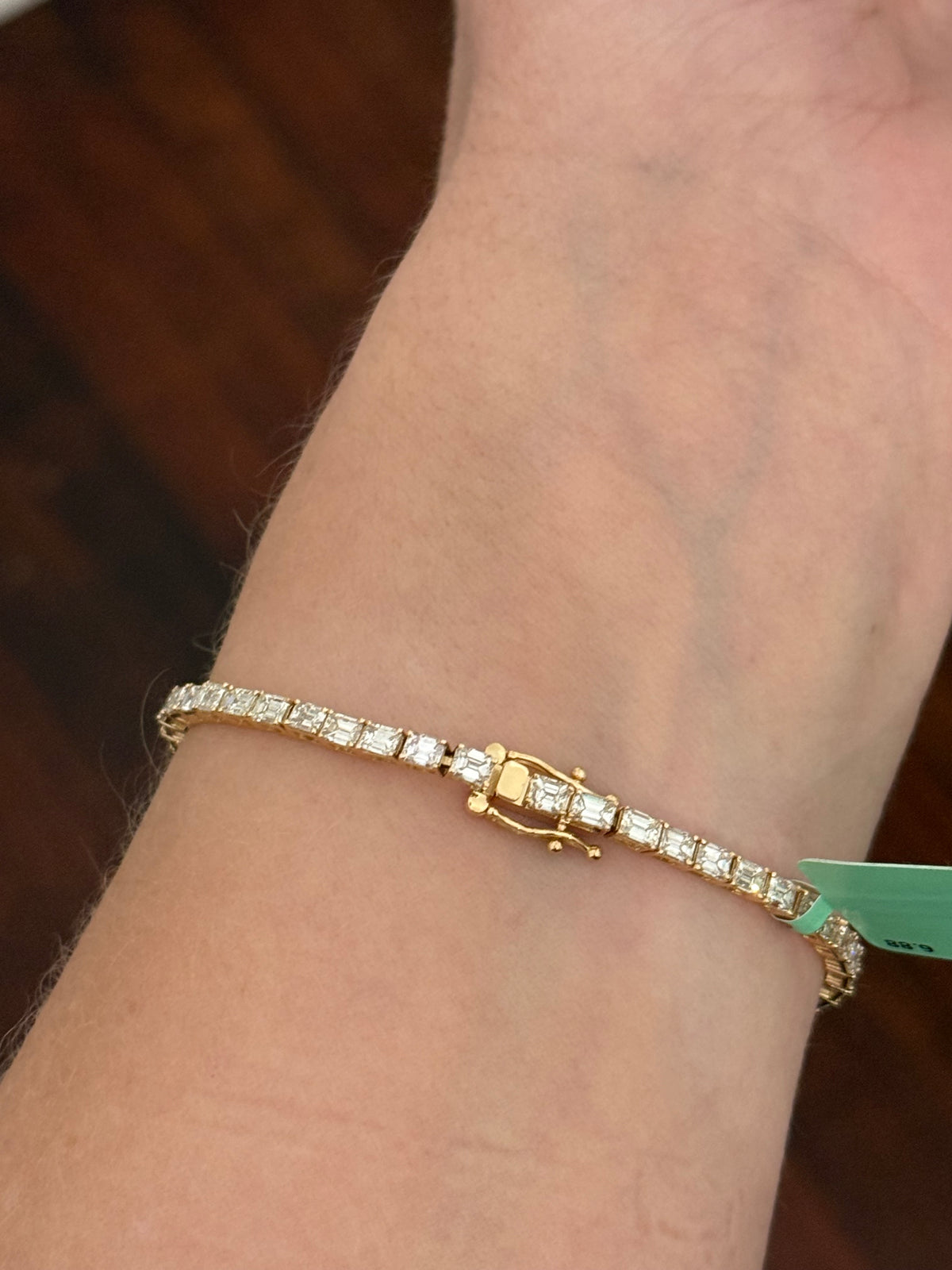 Yellow gold east west set 6.88ct emerald cut natural diamond bracelet