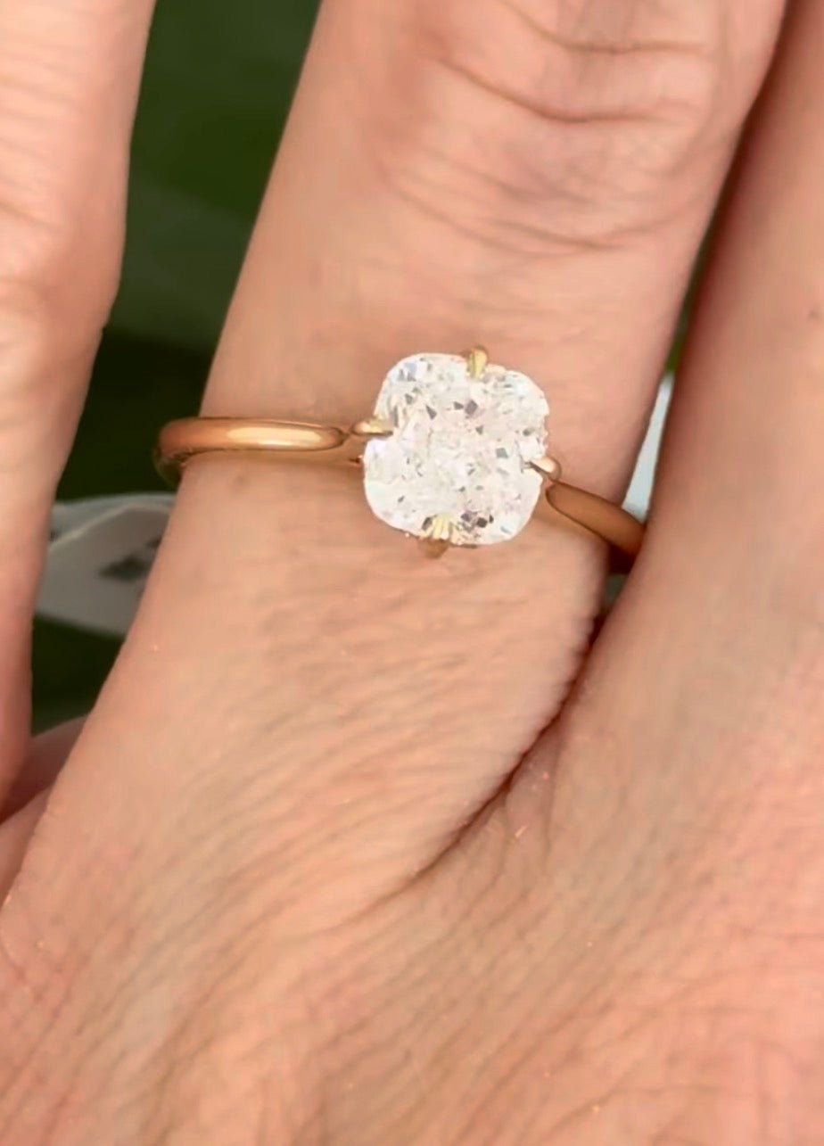 IGI certified yellow gold cushion and round lab diamond ring. Center stone is 1.57cts