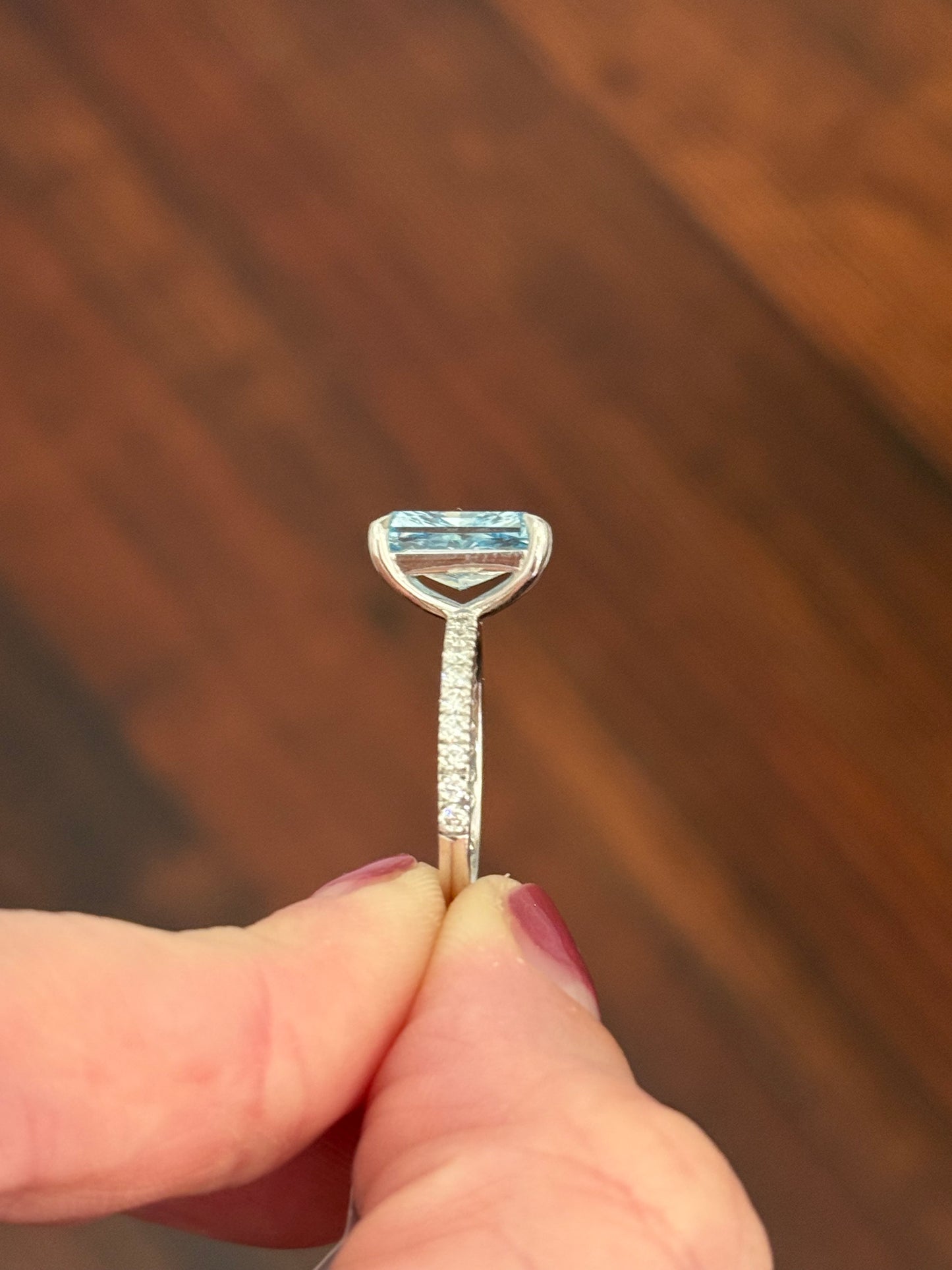 White gold radiant blue lab diamond and white lab diamond ring