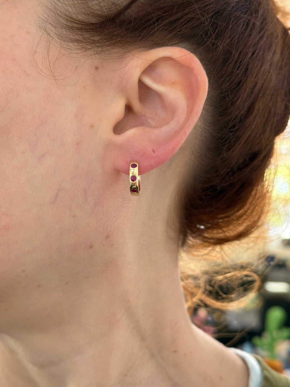 14.3mm hoop earrings available in yellow gold with rubies and white gold with emeralds