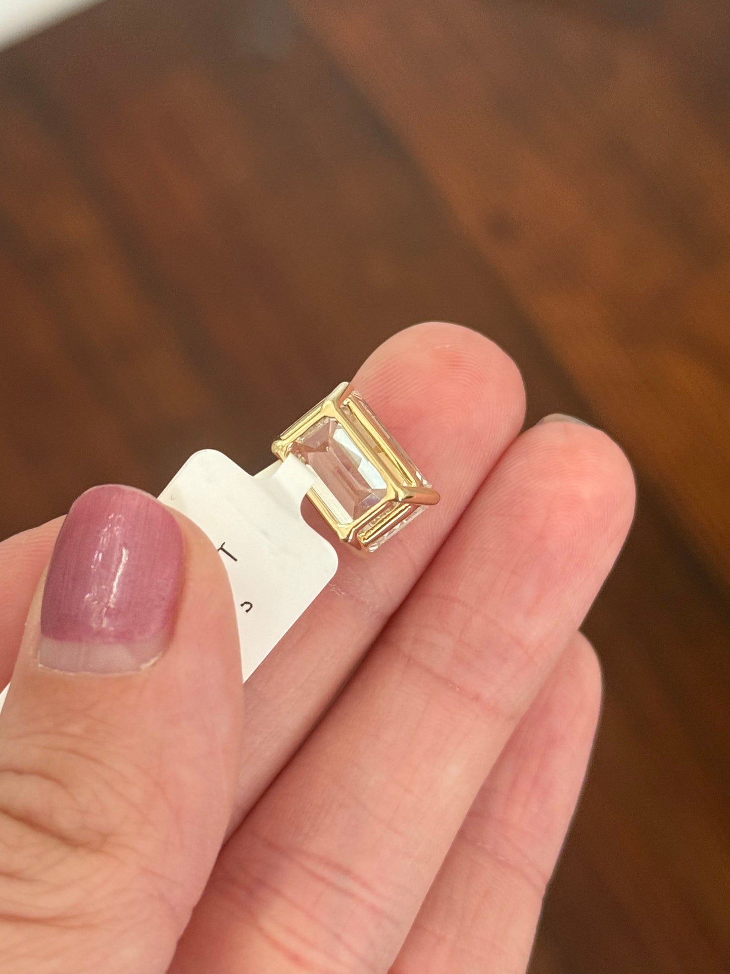 Yellow gold IGI certified 6.09ct emerald cut lab diamond pendant. Can be worn either east west or north south.