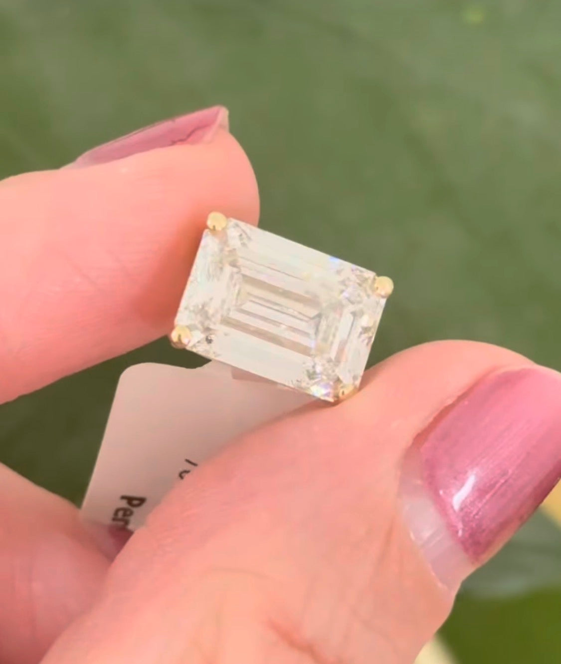 Yellow gold IGI certified 6.09ct emerald cut lab diamond pendant. Can be worn either east west or north south.