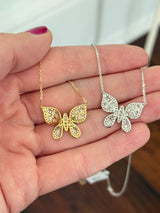 Butterfly necklaces with baguette and round diamonds available in white and yellow gold