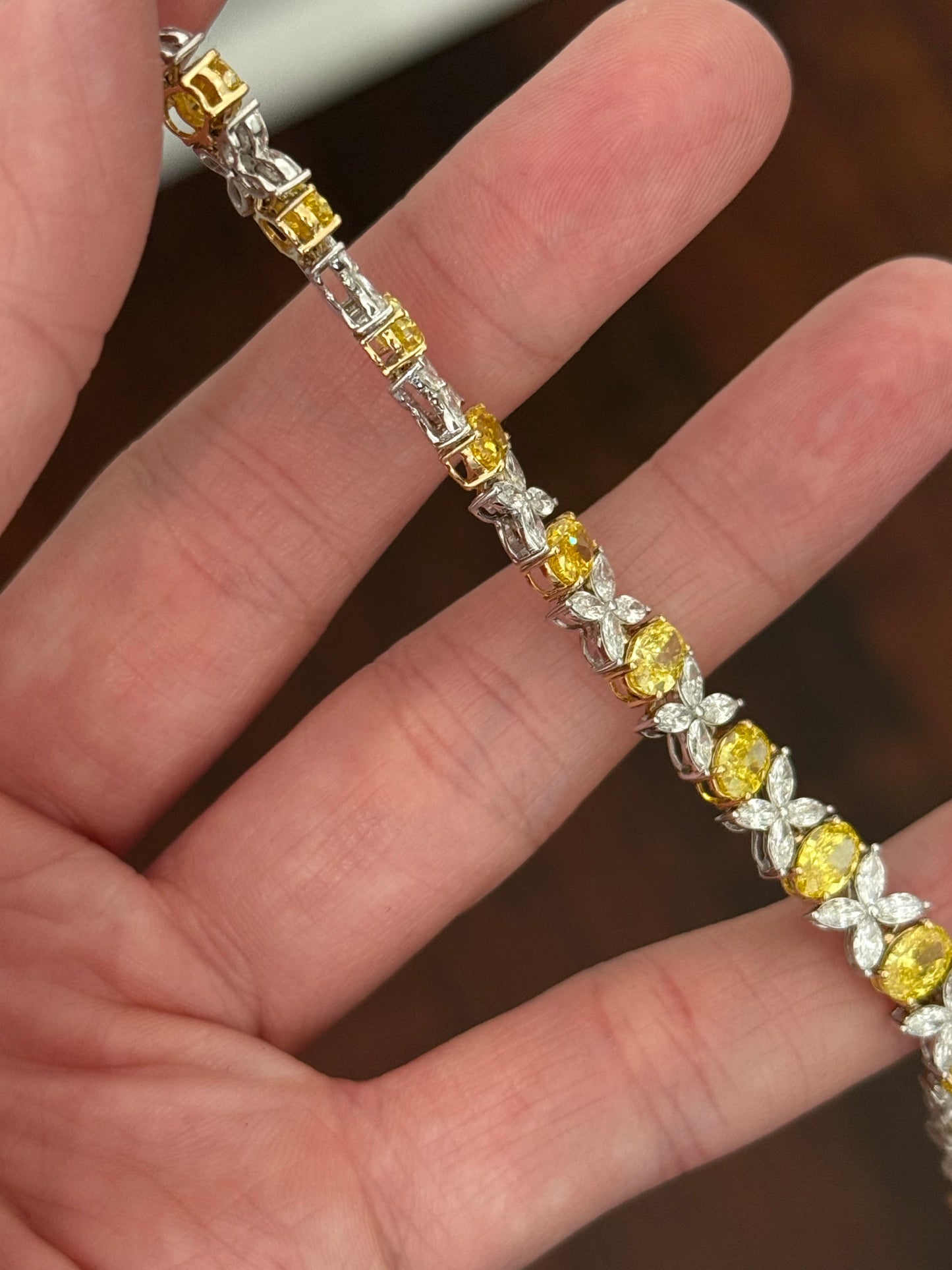 Yellow and white gold oval yellow lab diamond and marquise white lab diamond bracelet. Yellow lab diamonds are set in yellow gold and white lab diamonds are set in white gold.