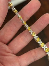 Yellow and white gold oval yellow lab diamond and marquise white lab diamond bracelet. Yellow lab diamonds are set in yellow gold and white lab diamonds are set in white gold.