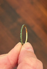 Yellow gold tsavorite eternity band