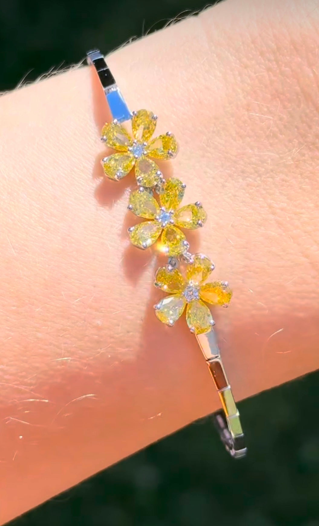 White gold flower bracelet with pear shaped yellow lab diamonds and round white lab diamonds