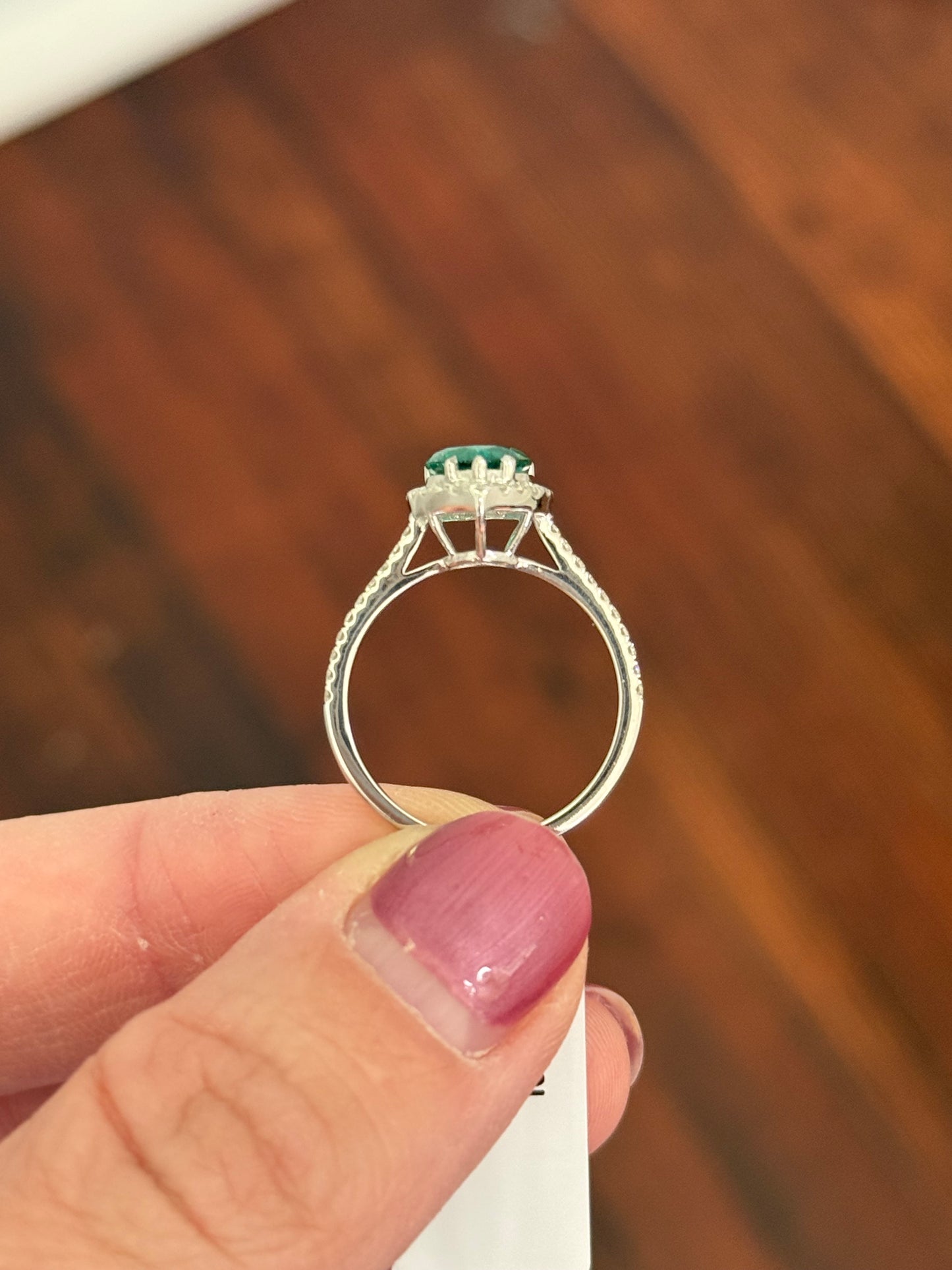 White gold heart shaped lab emerald and round lab diamond ring