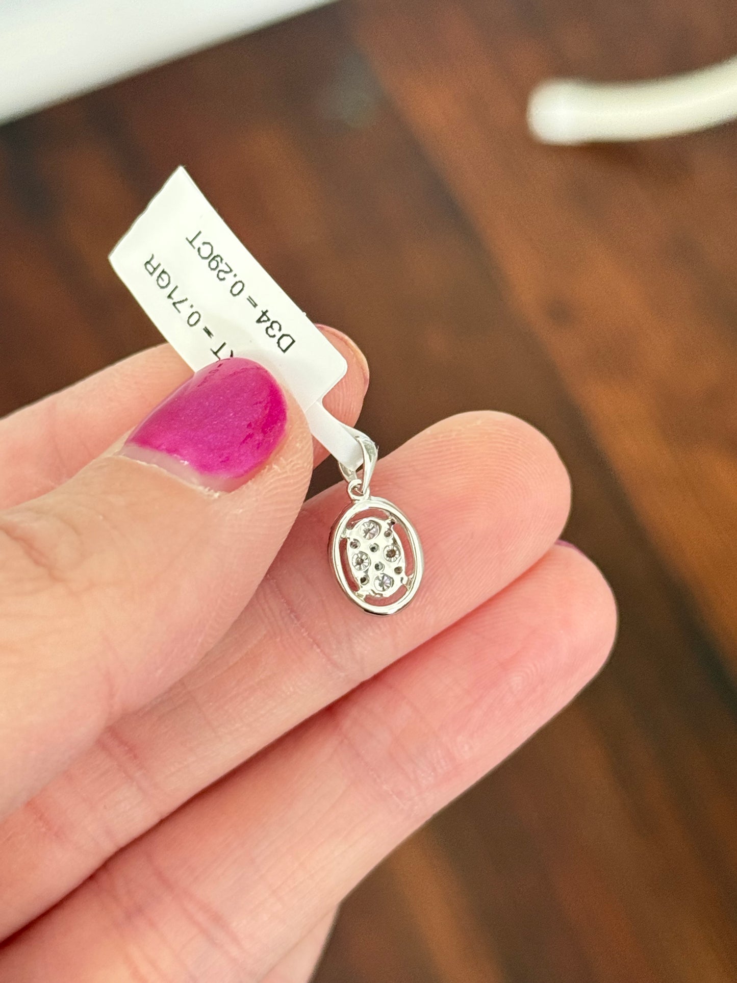 White gold cluster pendant with round diamonds