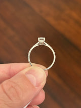 White gold 1.35ct emerald cut lab diamond ring. Center stone is 1.09cts and measures 6.7x4.3mm