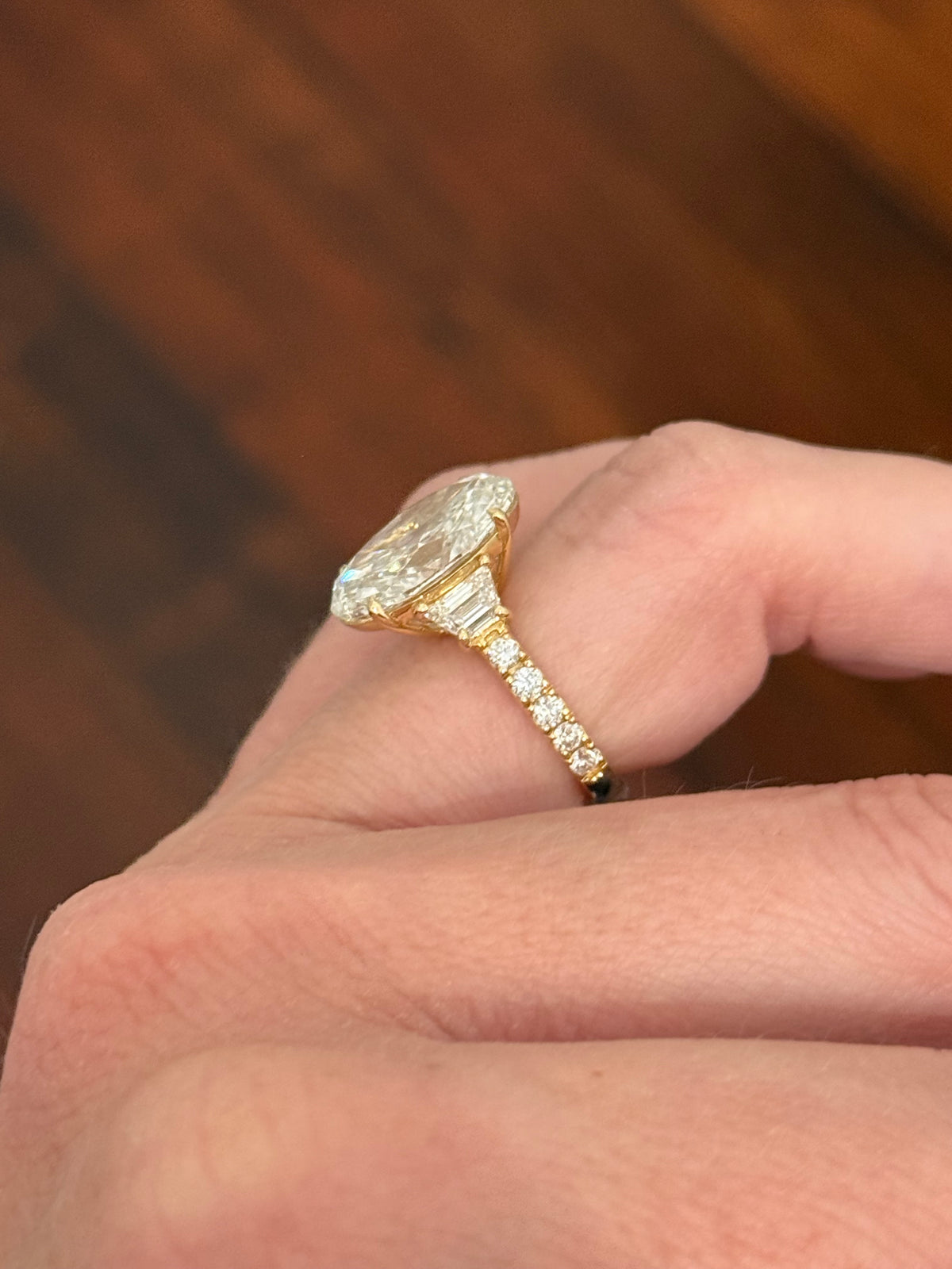 IGI certified oval and trapezoid and round lab diamond ring. Center stone is 6.52cts
