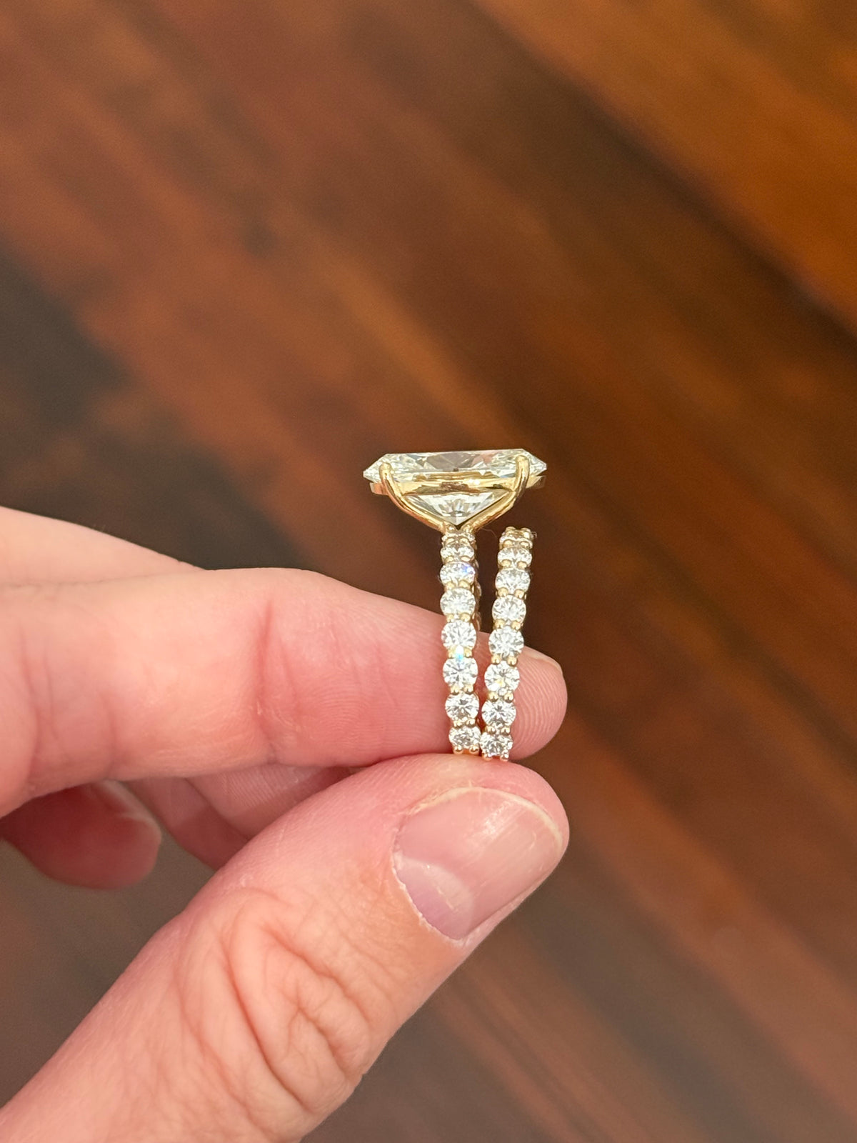 Yellow gold oval and round lab diamond ring and band set. Center stone is 6.58cts