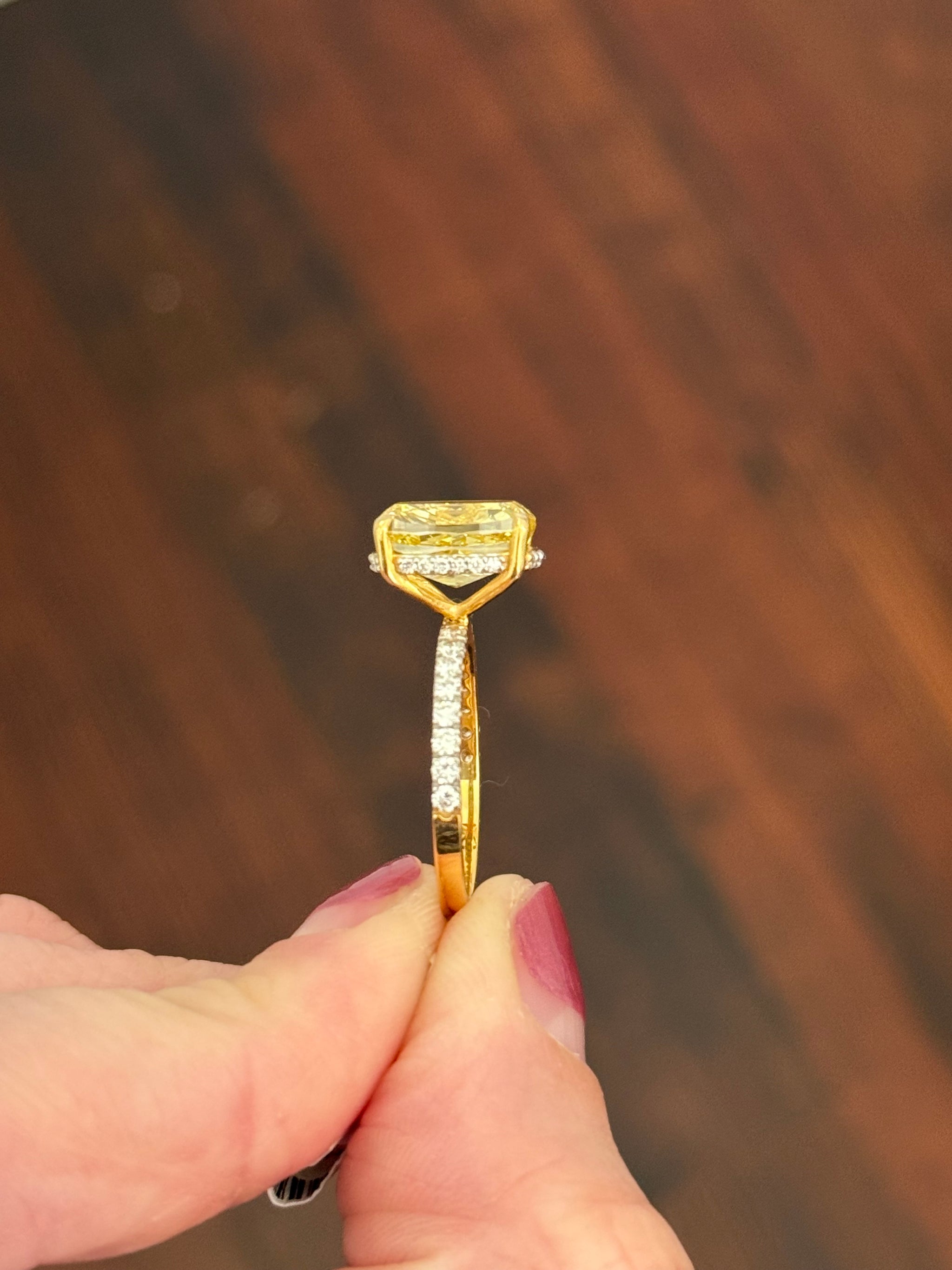 Yellow gold elongated cushion cut yellow lab diamond and white lab diamond ring