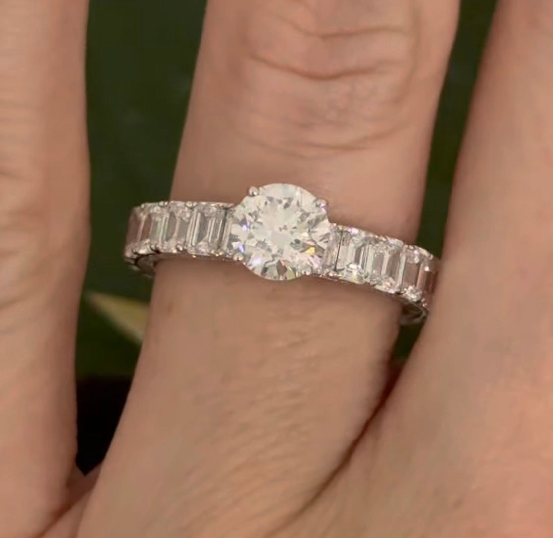 White gold 1.06ct round lab diamond and 4.14ct emerald cut lab diamond eternity ring