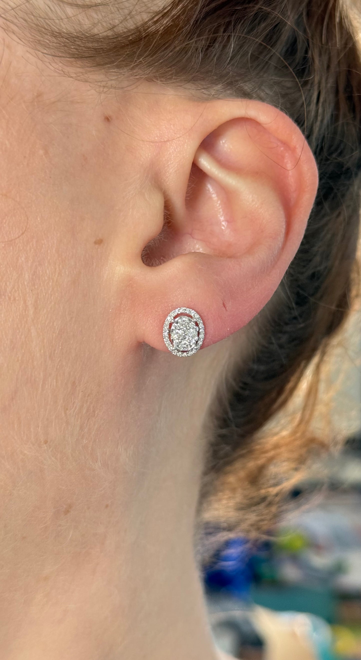 White gold oval cluster studs with round diamonds