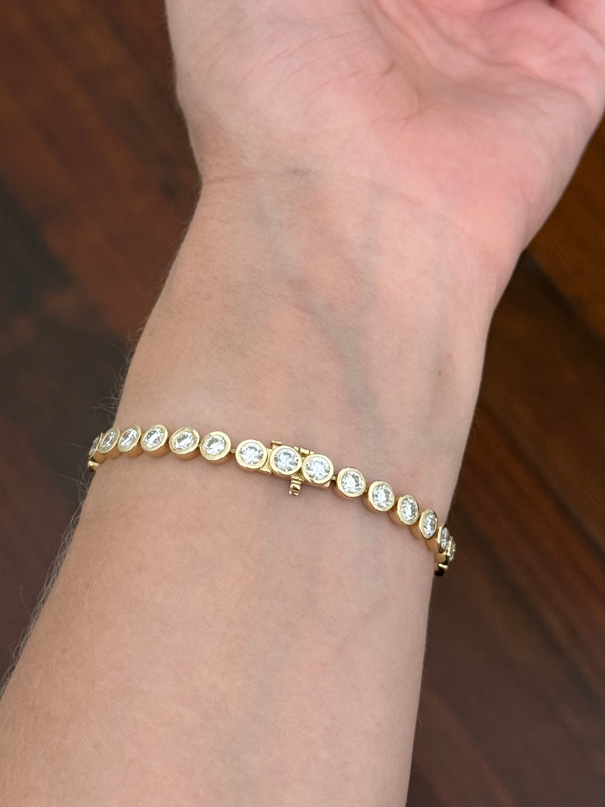 Yellow gold bezel set 8.65ct lab diamond tennis bracelet