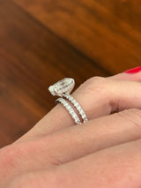 White gold oval lab diamond ring. Center stone is IGI certified and 3.03cts E VVS2