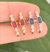 Natural diamond screw back earrings available in yellow gold with rubies and white gold with sapphires