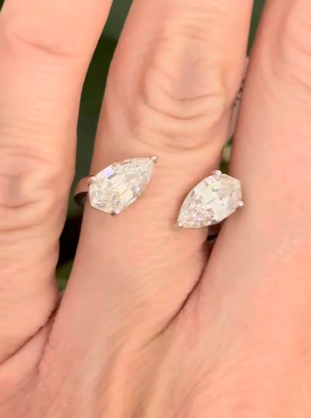 White gold 3.15ct step cut pear shape lab diamond bypass ring. Each measures 10.45x5.70mm