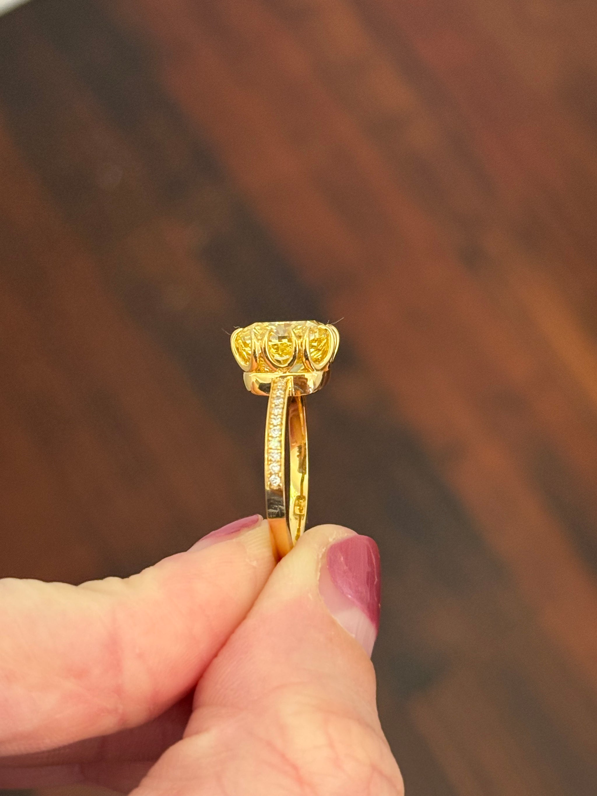 Yellow gold cushion cut yellow lab diamond and white lab diamond ring