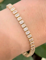 Yellow gold bezel set 10.07ct emerald cut lab diamond bracelet