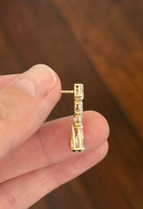 Yellow gold pear shape and oval lab diamond earrings. Prongs are white gold.