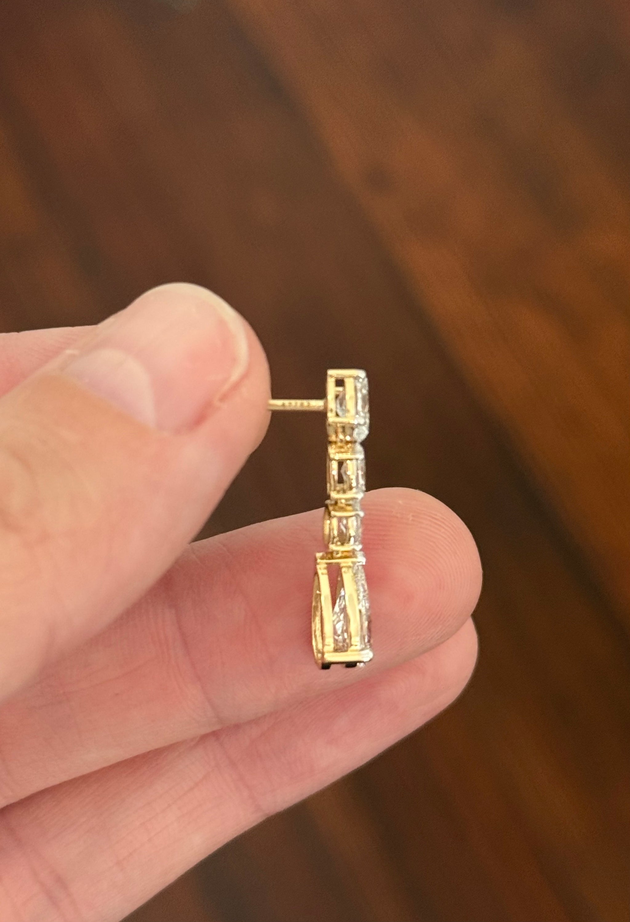 Yellow gold pear shape and oval lab diamond earrings. Prongs are white gold.
