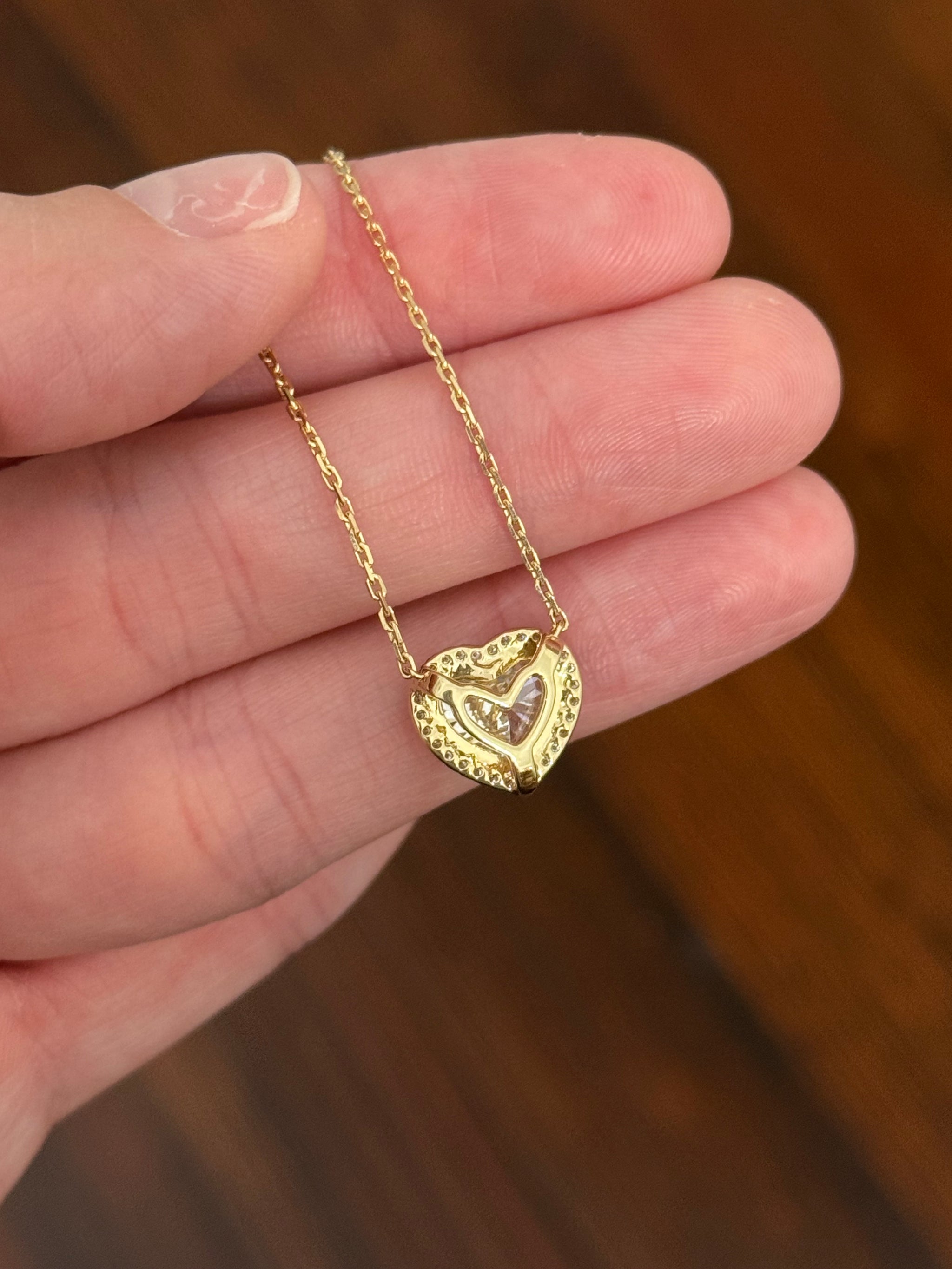 Yellow gold heart shaped lab diamond necklace. Center stone is 3.05cts and measures 8.7x9.6mm. Chain is 16” with 4” of adjustment to make as long as 20”.