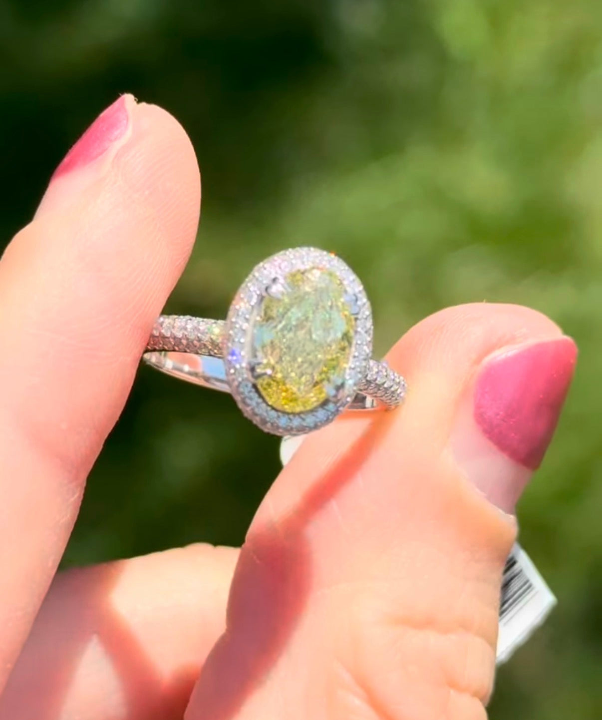 White gold oval lab diamond and white lab diamond ring