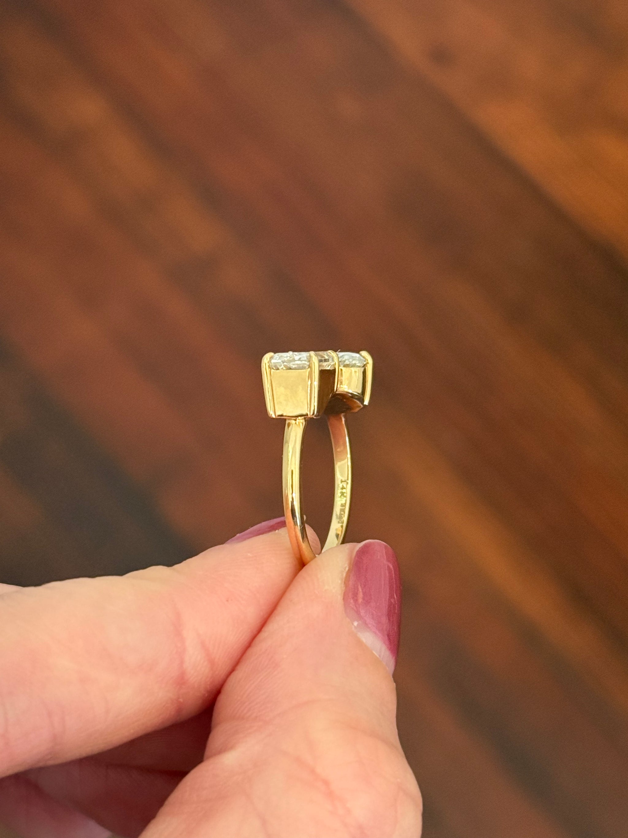 Yellow gold emerald cut and oval lab diamond toi et moi ring