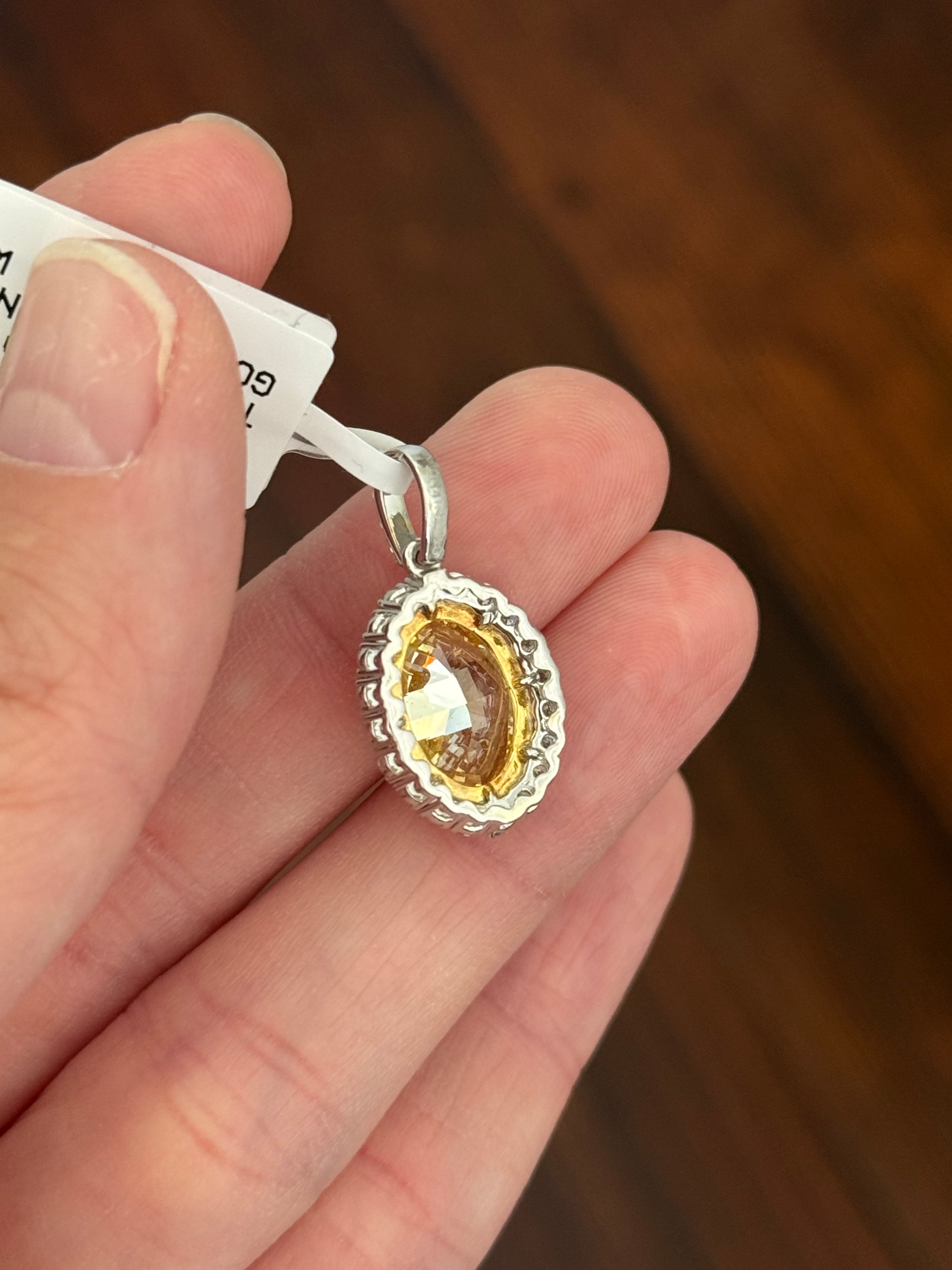 White gold oval yellow lab diamond and white round lab diamond pendant. Yellow lab diamond has yellow gold prongs and is IGI certified 5.11cts fancy vivid yellow VS2