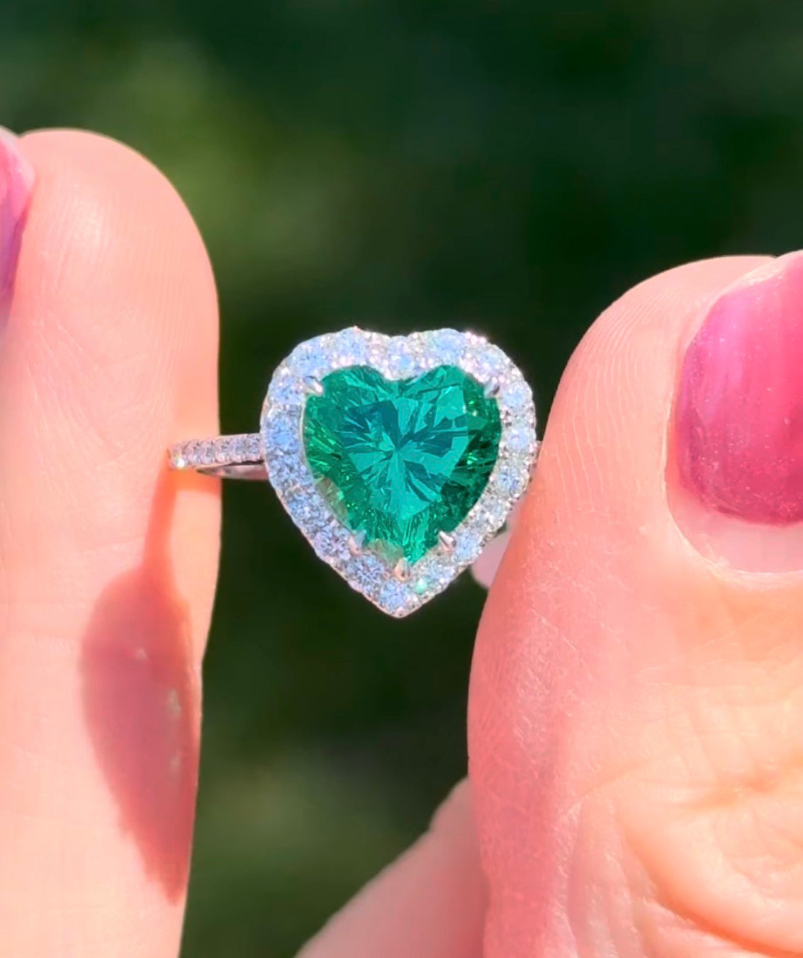 White gold heart shape lab emerald and round lab diamond ring
