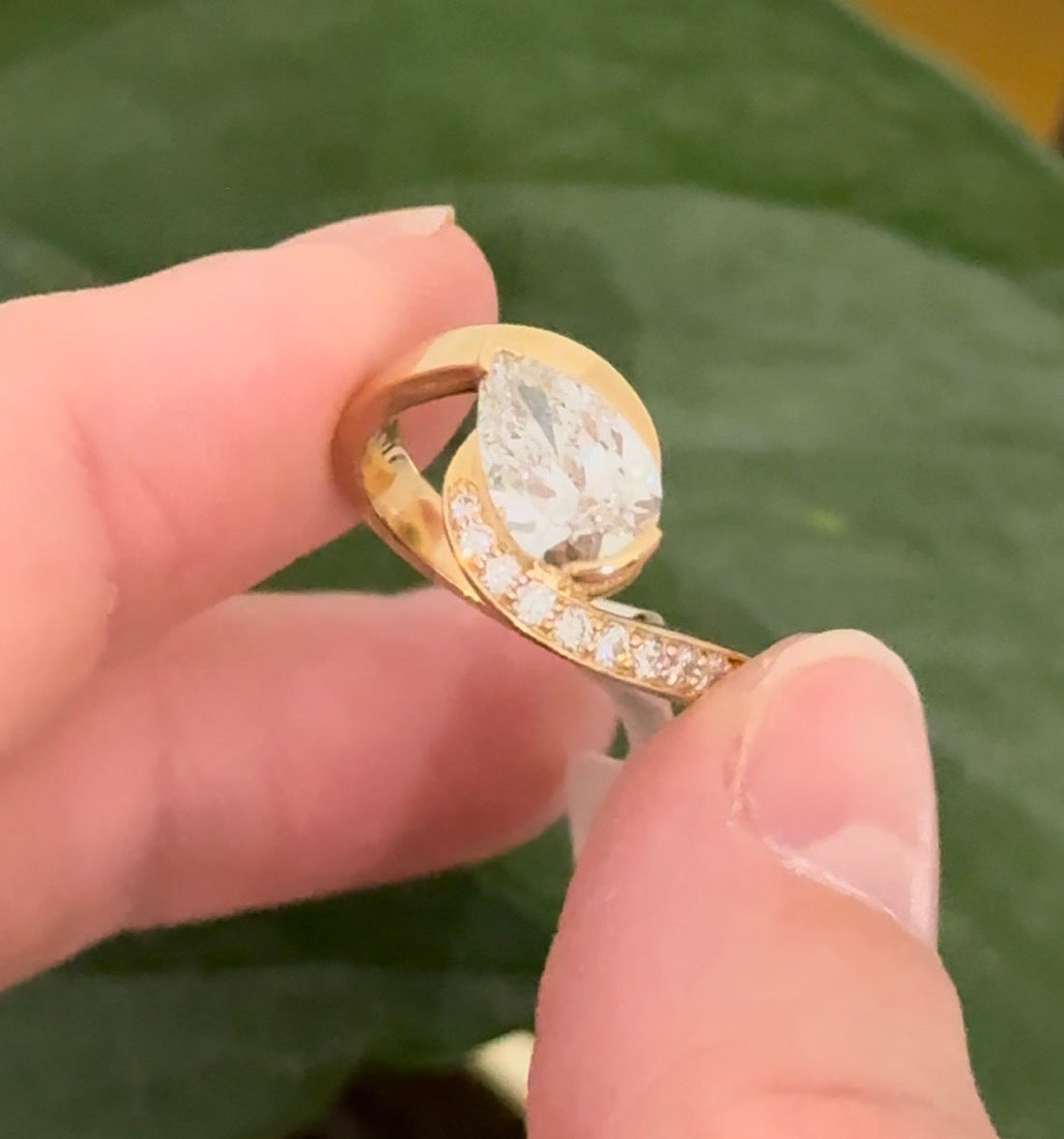 Yellow gold pear shape and round lab diamond ring. Pear shape is IGI certified and 1.54cts E VS1
