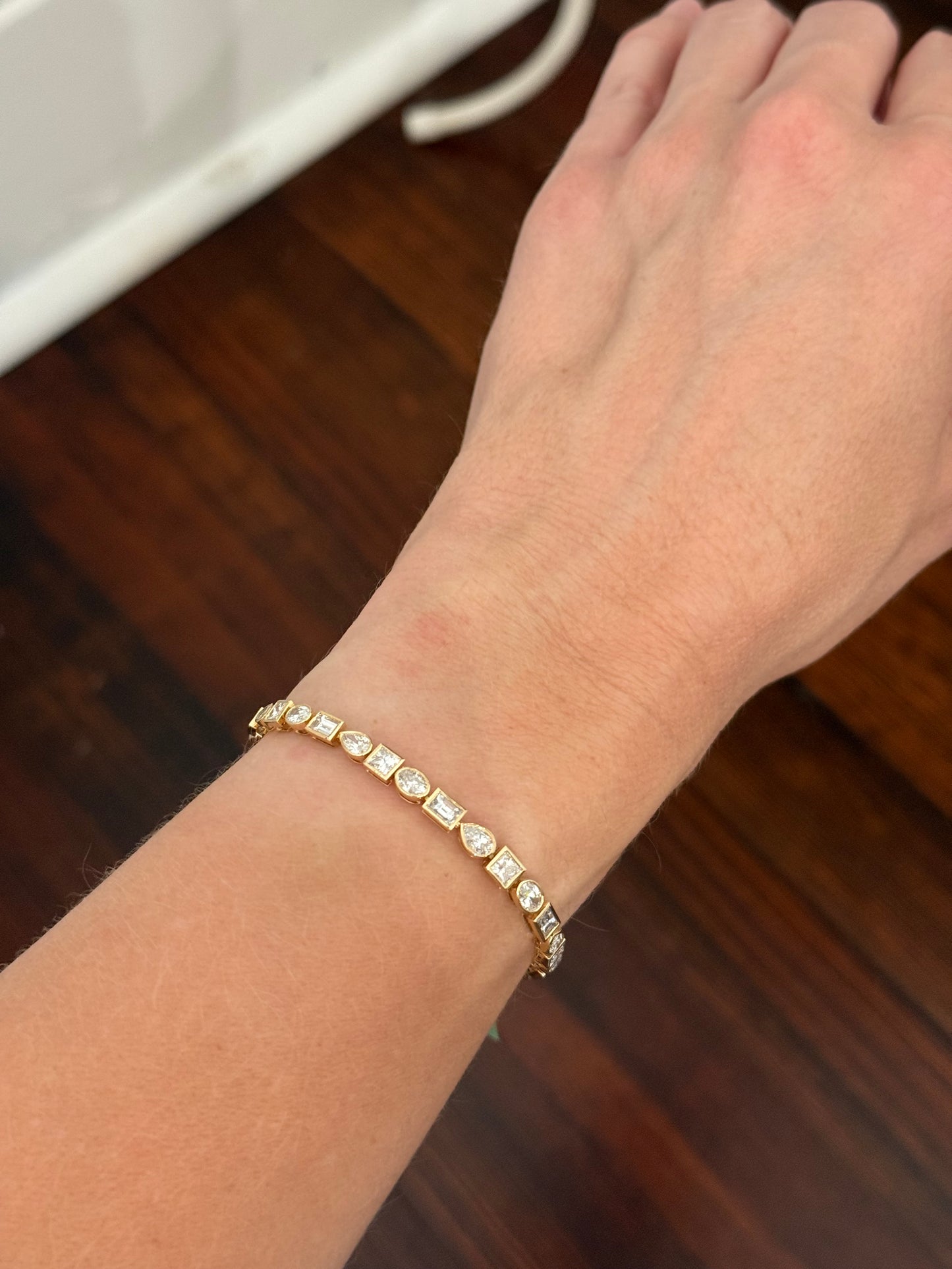 Yellow gold bezel set 6.68ct pear shape, oval, princess and emerald cut natural diamond bracelet