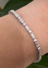 White gold bezel set 4.22ct tapered baguette and round natural diamond bracelet