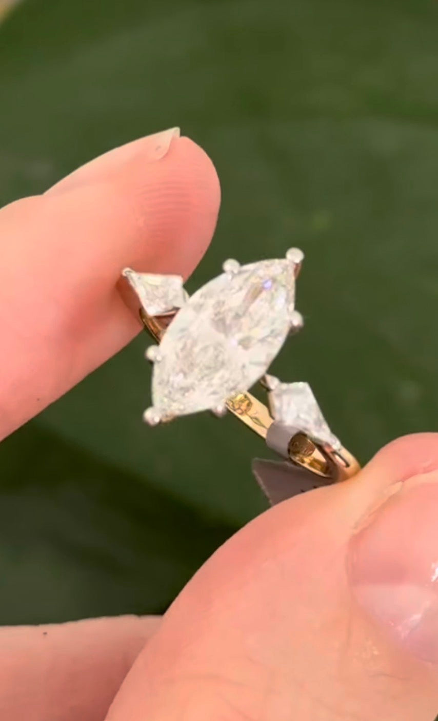 Yellow gold marquise and kite lab diamond ring. Prongs are white gold.