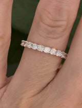 Yellow gold cushion cut lab diamond band. Prongs are white gold.
