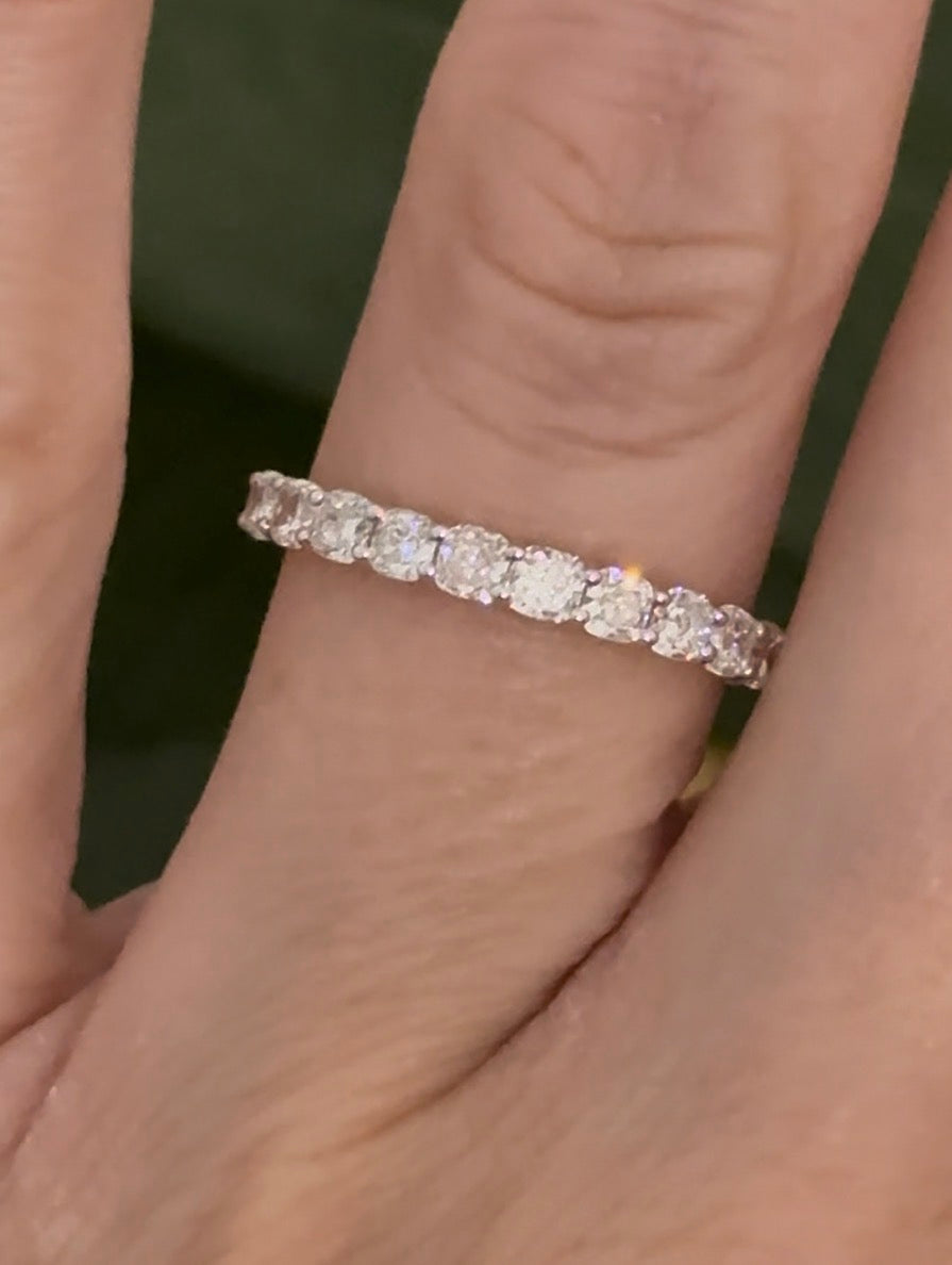 Yellow gold cushion cut lab diamond band. Prongs are white gold.