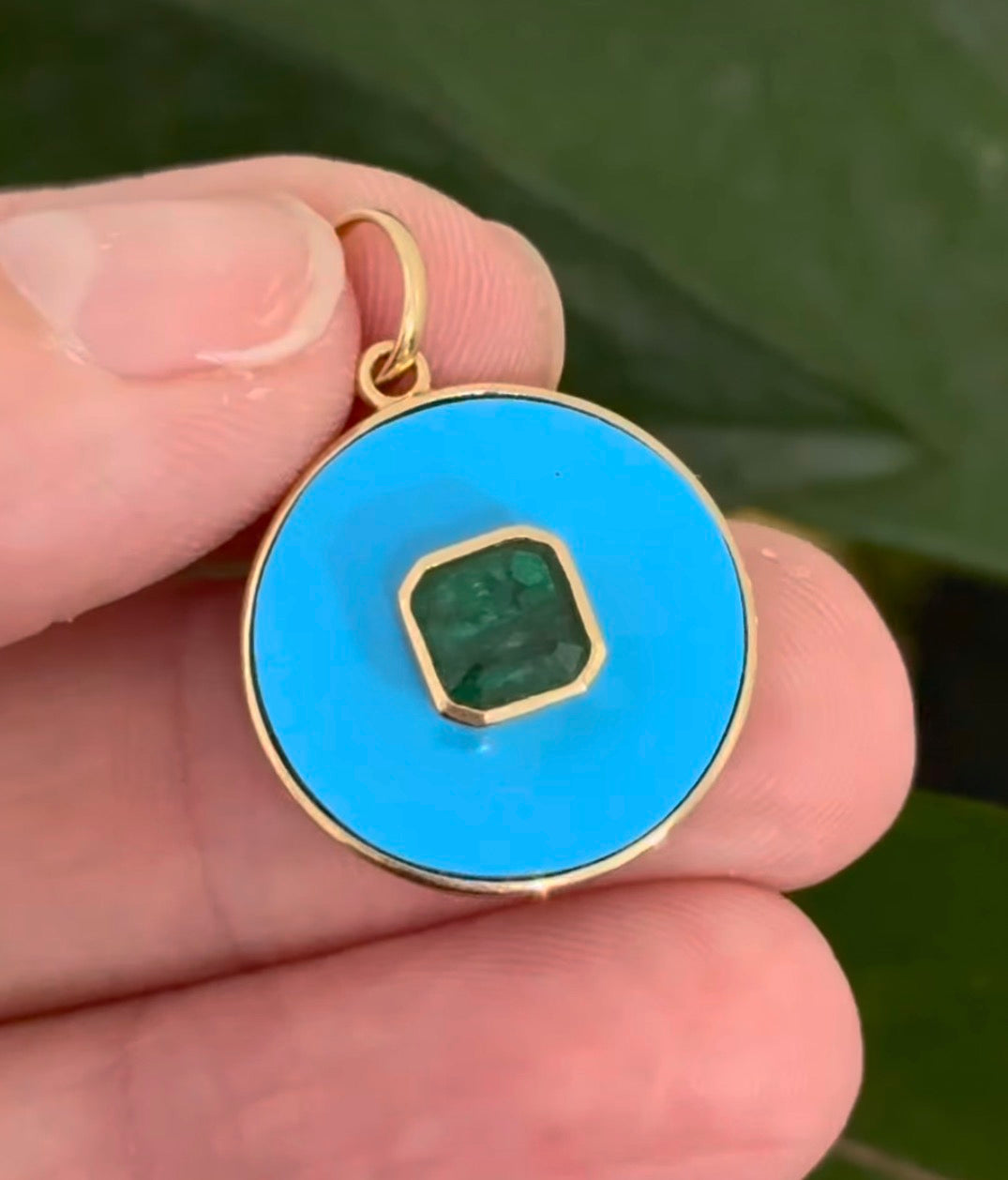 Yellow gold emerald pendant
