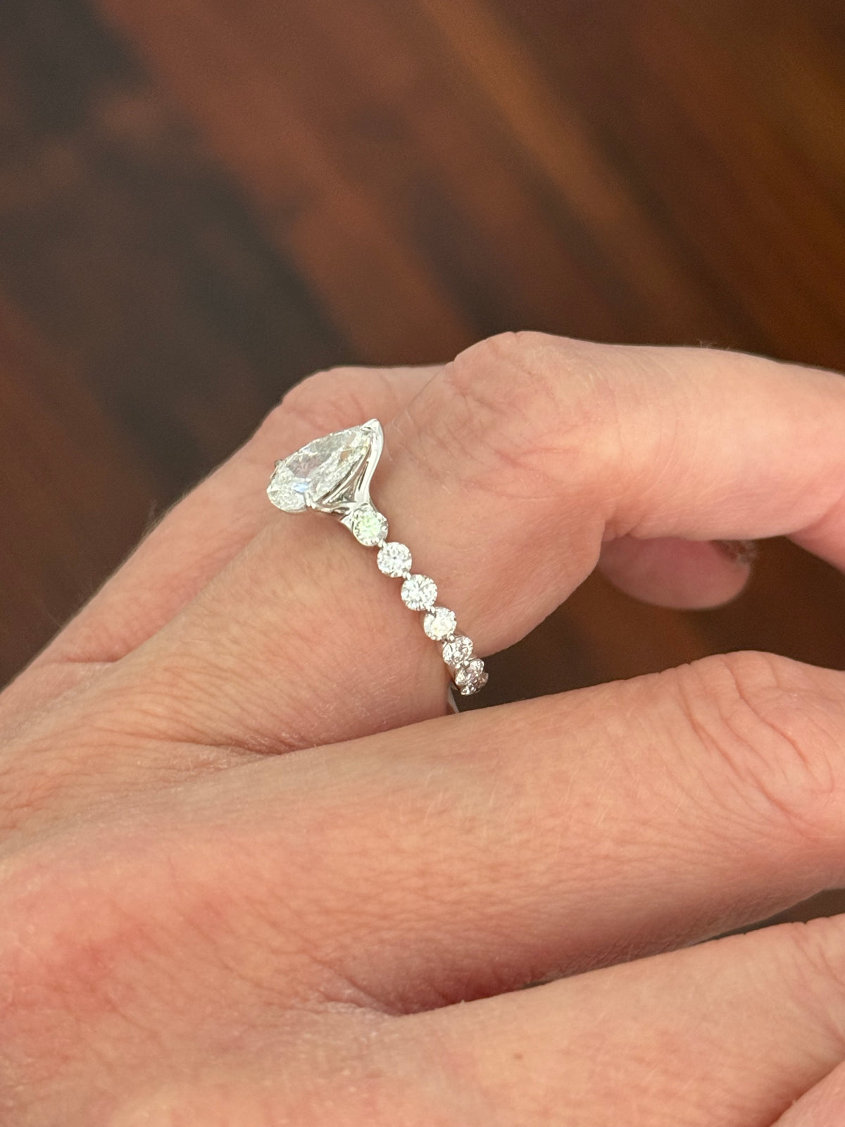 White gold pear shape and round lab diamond ring. Center stone is 1ct and approximately 9x5.3mm