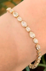 Yellow gold bezel set 7.58ct marquise, oval, emerald cut and pear shape natural diamond bracelet