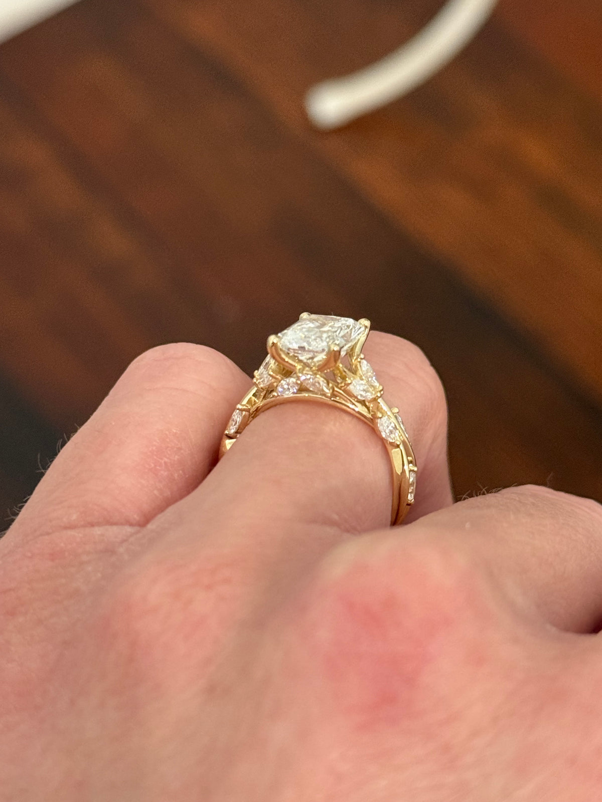 Yellow gold radiant and marquise lab diamond ring. Center stone is 3.07cts E VS1 and measures 9.8x6.7mm